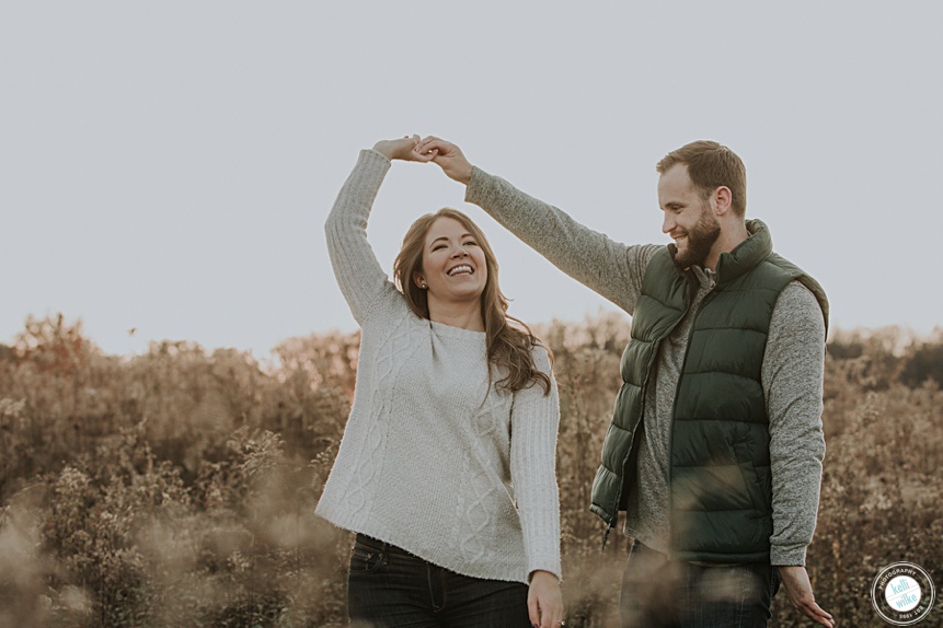 longwood gardens engagement photo of a couple in the meadow