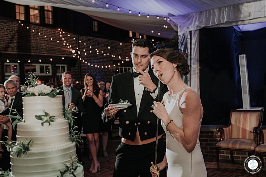 cake cutting with a military sword at the greenville country club wedding 