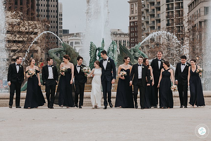 wedding party poses at a fountain in philadelphia wearing navy and cream near the The Logan Hotel in Philadelphia PA. Wedding coordinators: The Styled Bride, Hair by Amanda Andrea, Makeup by Beke Beau