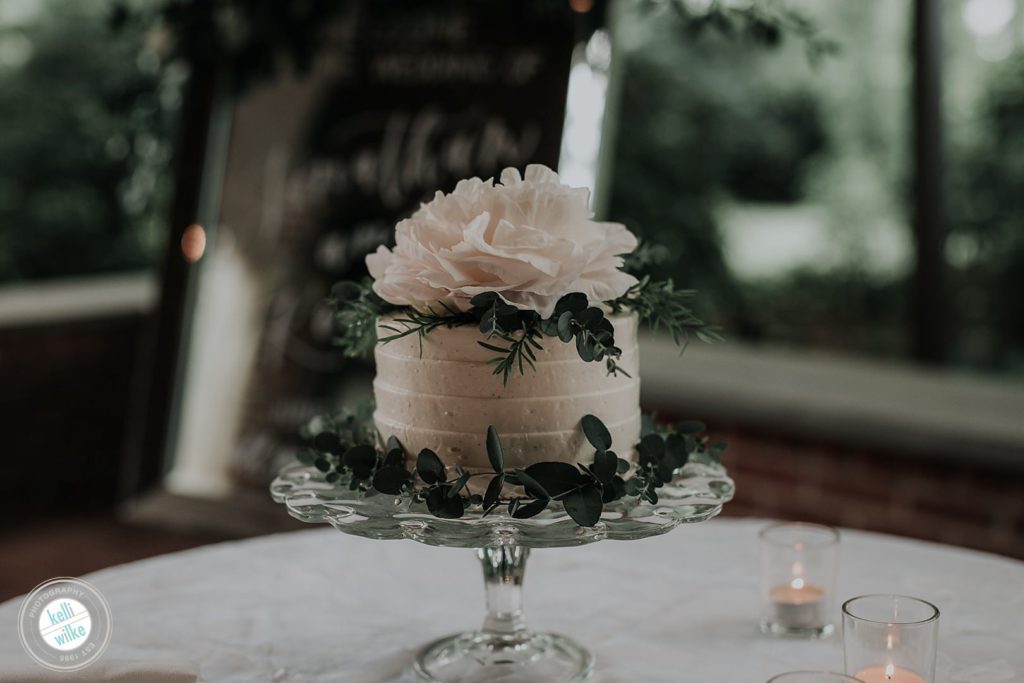 a sweet small wedding cake made by MM Pastry Design in Wilmington DE with a Peony topper at Greenville Country Club