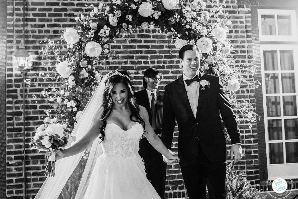 Bride and groom walk down the aisle after their wedding ceremony at Greenville Country Club in Greenville Delaware