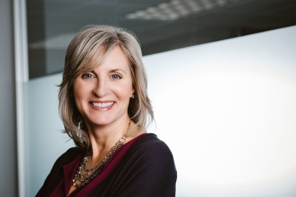 examples of a good headshot of a woman in her office