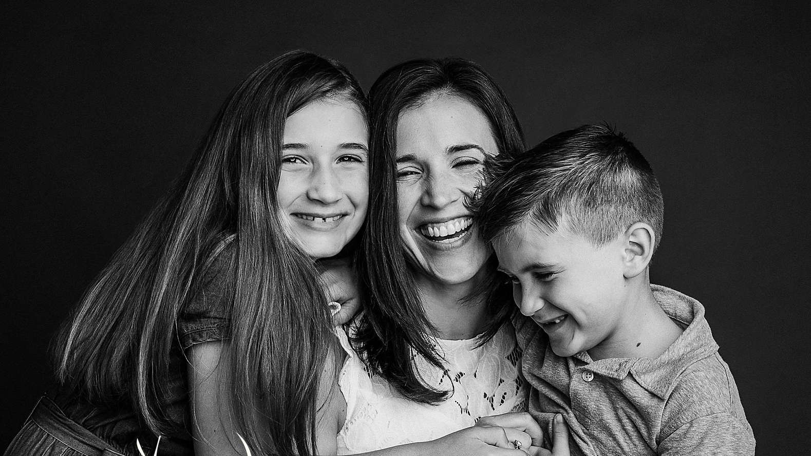 portrait of a mother and her children in black and white