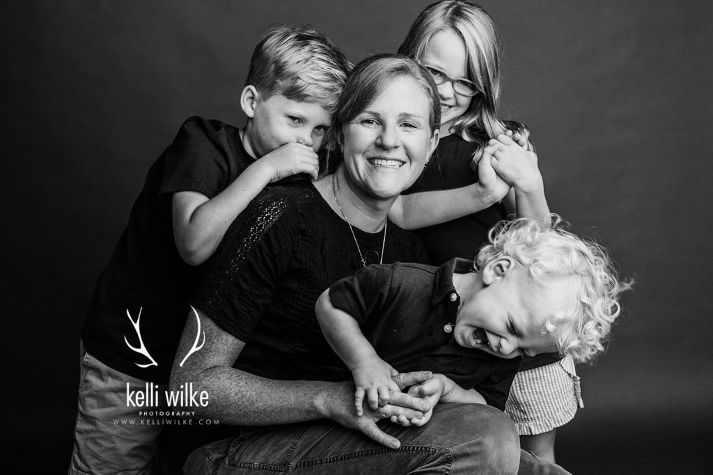 photograph of a mother and her children celebrating mothers