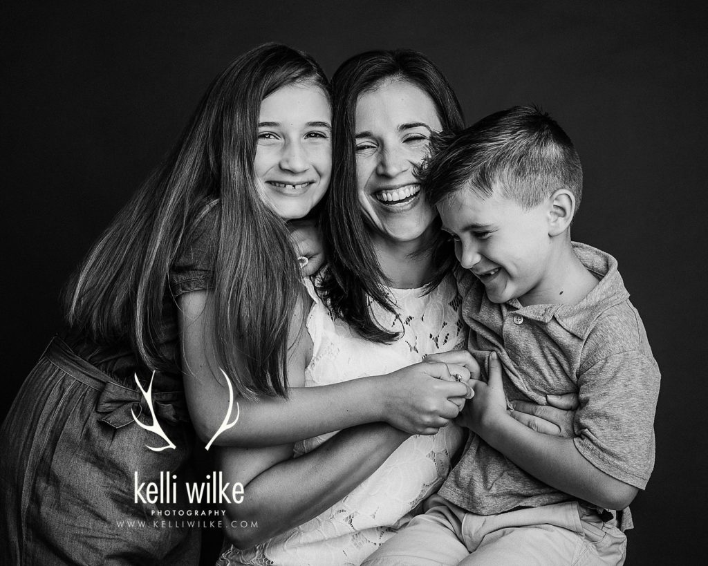 mother with her daughter and son in a studio portrait