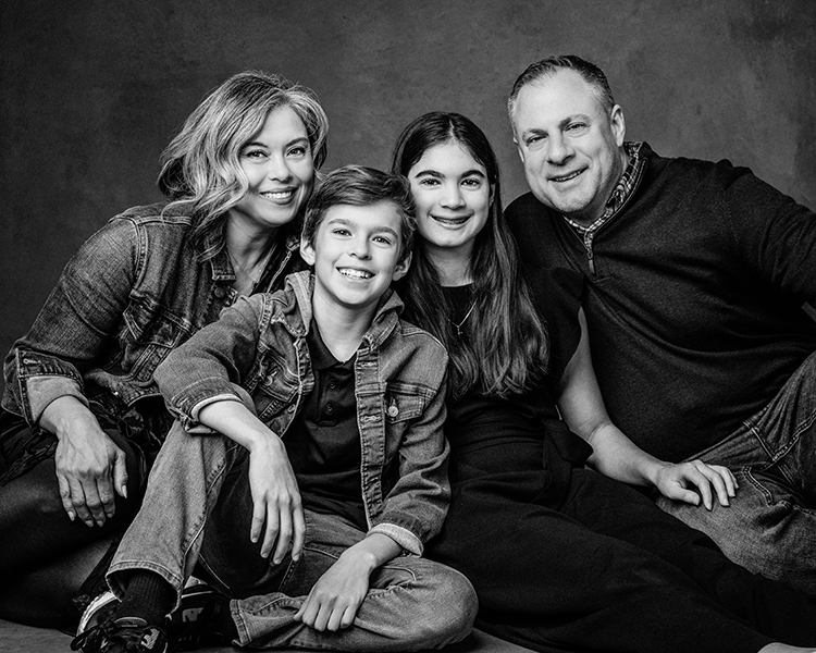 black and white photo of a family with two children