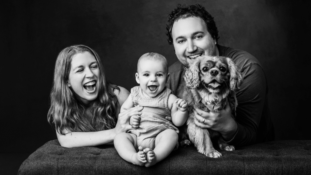 Smiling family in a studio by a professional family photographer