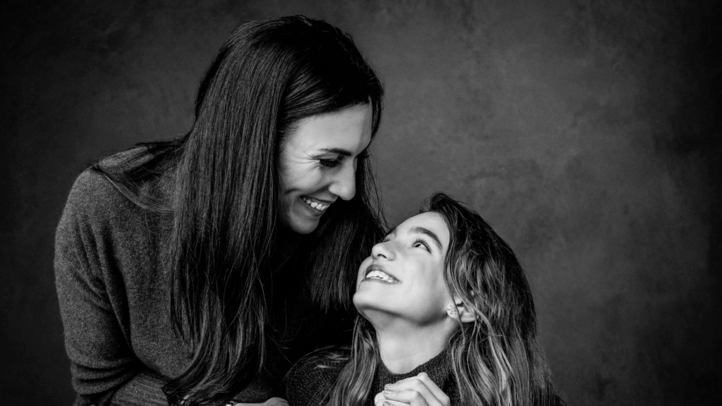 Professional family photographer capturing timeless black and white portraits